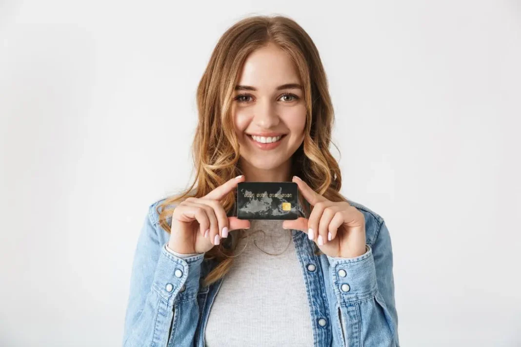 a girl holding credit card