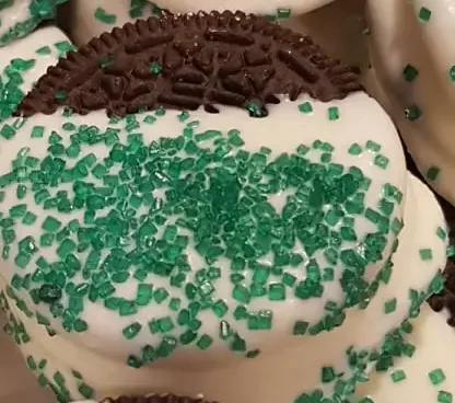 Let the kids have fun making St. Patrick's Day Chocolate Dipped Oreos With Green and White Sprinkles